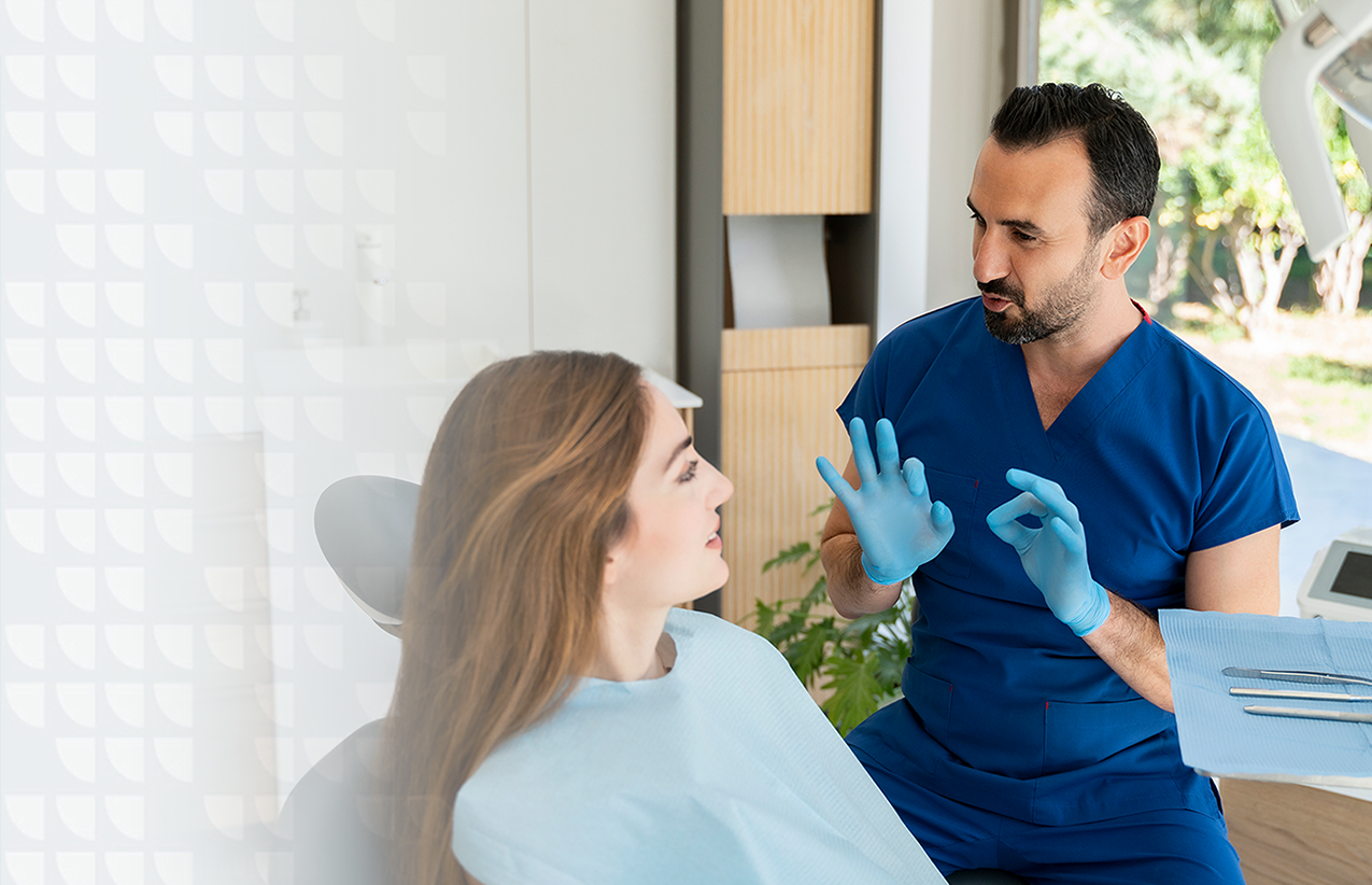 Dentist talking to patient about dental procedure